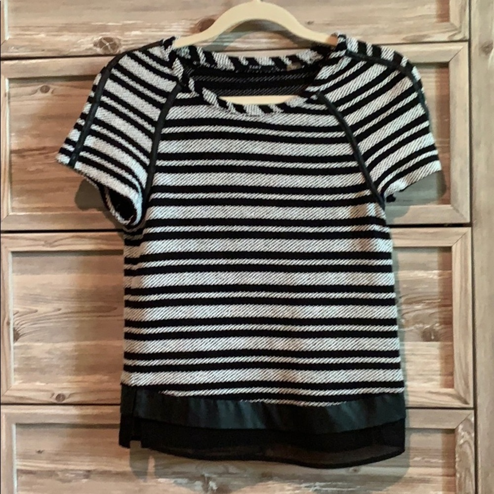 White and black woven top with leather accents